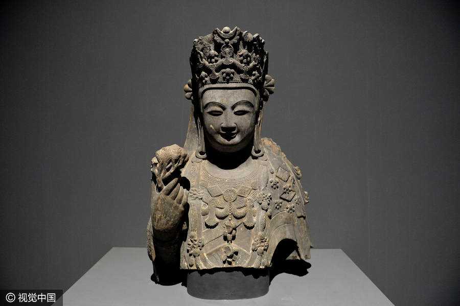 Chinese and Indian sculptures on display at the Palace Museum in Beijing