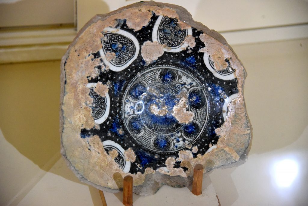 A partially survived glazed glass plate. From modern-day Iraq; precise provenance of excavation is unknown. Abbasid period, 750-1258 CE. Erbil Civilization Museum, Iraqi Kurdistan. Photo © Osama S. M. Amin.