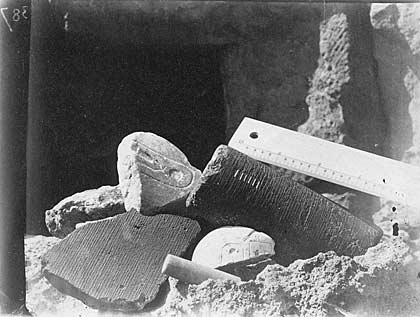 a black and white photo of Egyptian fragments of stone and copper