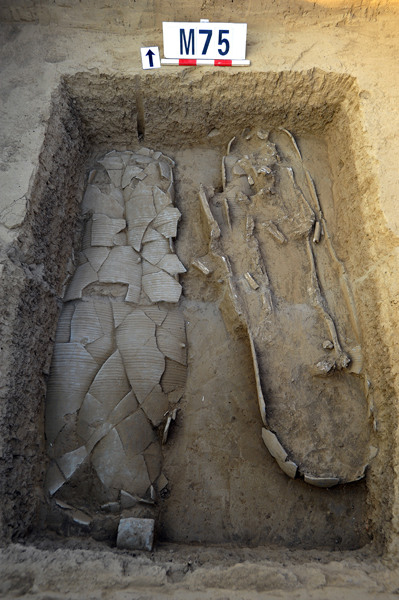 An adult urn burial site from the Warring States Period (475-221 BC) discovered in Hugezhuang. (Photo/China Daily) An adult urn burial site from the Warring States Period (475-221 BC) discovered in Hugezhuang. (Photo/China Daily)