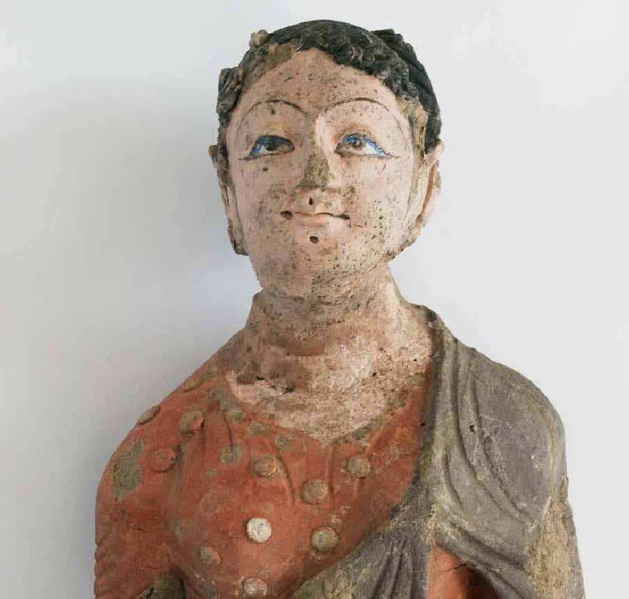 有着“黑色卷曲头发”的女供养人彩绘泥塑。  资料图