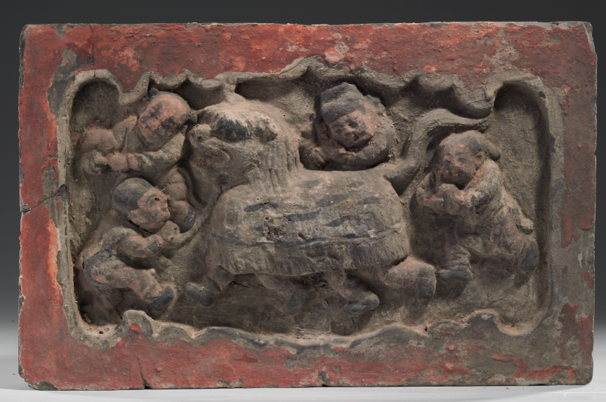 “社火”舞狮砖雕,金代(1115-1234),高23厘米,宽33厘米,厚4.5厘米,1981年山西省新绛县南范庄出土